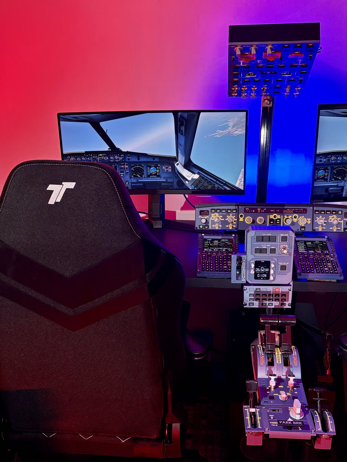 The full Aviation Simulator Station rig with dual seats and instrument displays under blue and pink lighting.