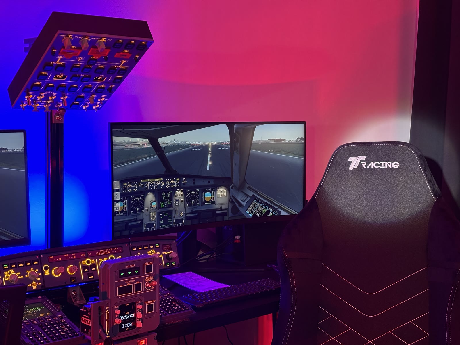 A wide view of the Aviation Simulator Station seats and overhead panel under accent lighting.